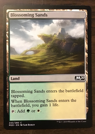 Nonbasic land: Blossoming Sands, card green to vanilla gradient.