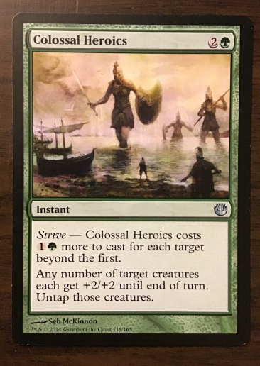 Colossal Heroics, green instant showing giant Greek soldier with a sword and shield